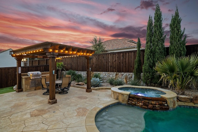 exterior space with a fenced backyard, grilling area, outdoor dining area, exterior kitchen, and a pool with connected hot tub