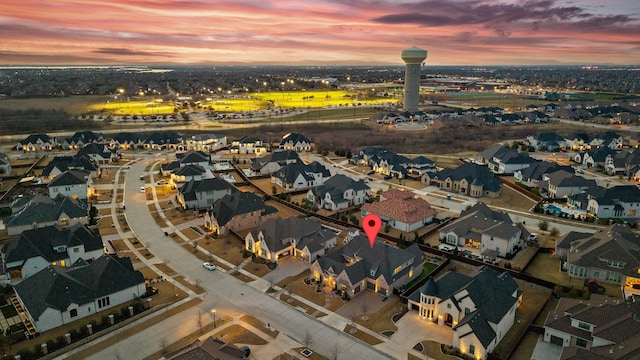 aerial view at dusk with a residential view