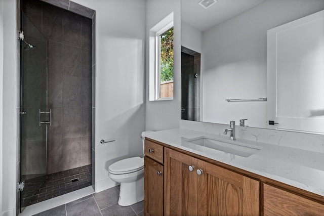 bathroom featuring tile patterned flooring, toilet, visible vents, vanity, and a stall shower