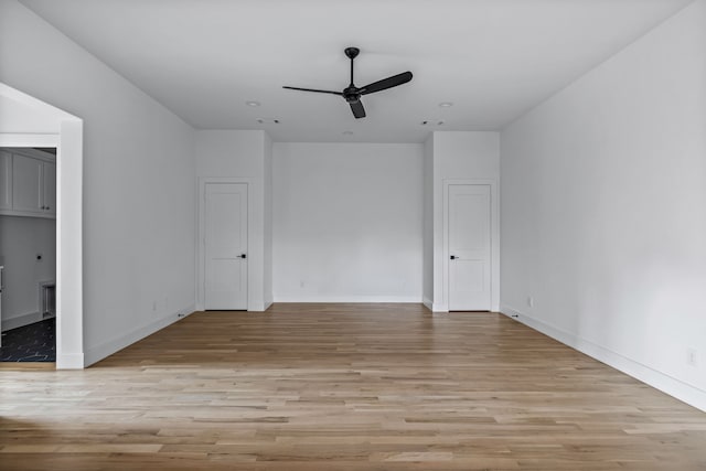 unfurnished bedroom with baseboards, visible vents, and light wood-style floors