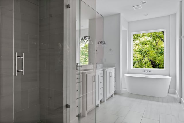 full bath with visible vents, a soaking tub, a shower stall, and vanity