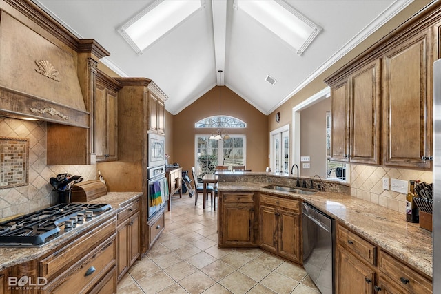 kitchen featuring visible vents, brown cabinetry, lofted ceiling with beams, appliances with stainless steel finishes, and a sink