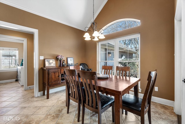 dining space with a chandelier, light tile patterned flooring, and baseboards