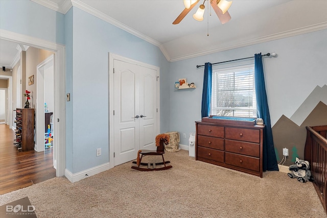 interior space with baseboards, vaulted ceiling, and crown molding