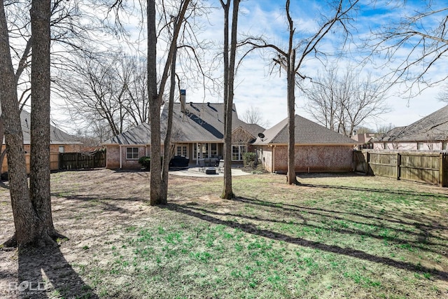 view of yard featuring a fenced backyard and a patio