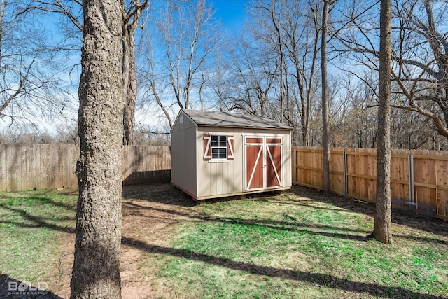 view of shed with a fenced backyard