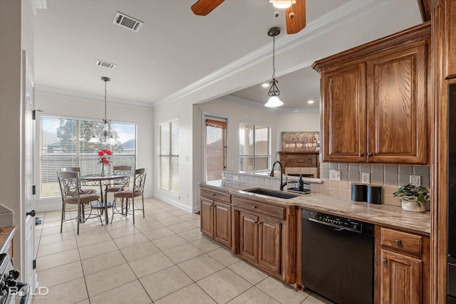 kitchen featuring black dishwasher, visible vents, brown cabinets, a sink, and backsplash