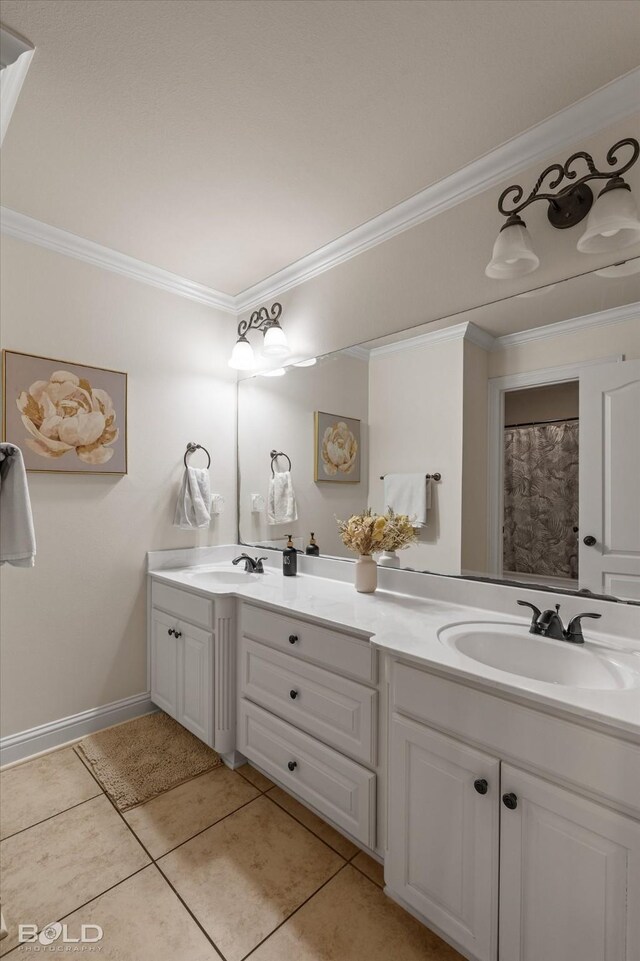 bathroom with double vanity, ornamental molding, a sink, and tile patterned floors