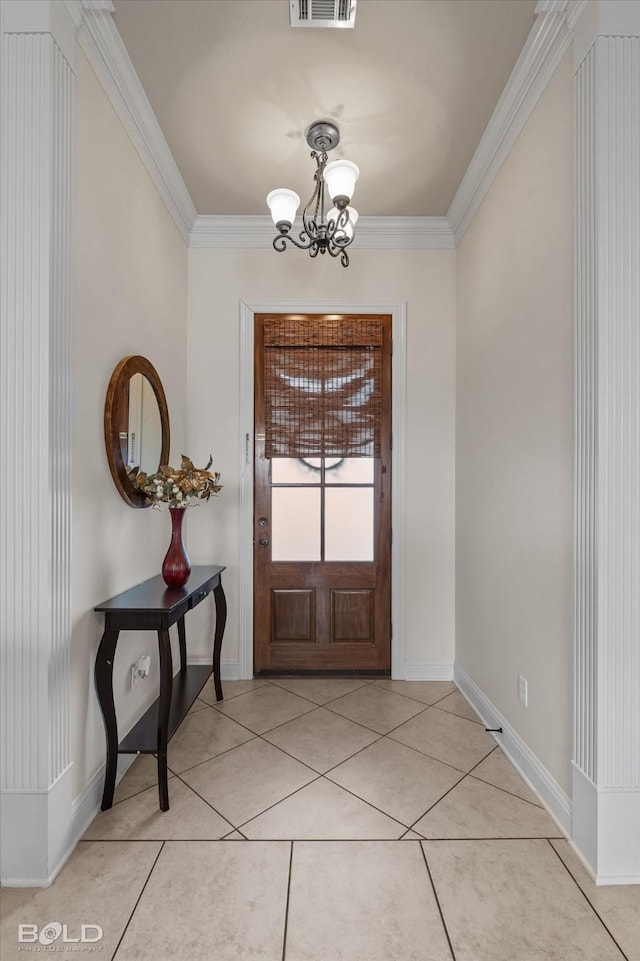 foyer entrance featuring light tile patterned floors, visible vents, a chandelier, and crown molding