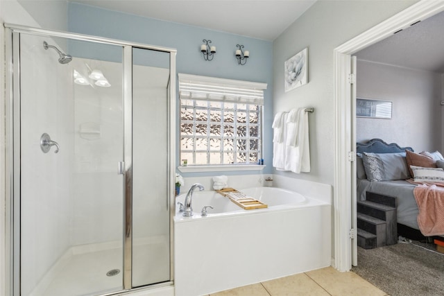 full bath featuring tile patterned floors, connected bathroom, a shower stall, and a garden tub