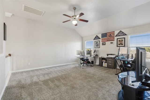 home office featuring visible vents, baseboards, carpet, lofted ceiling, and a ceiling fan