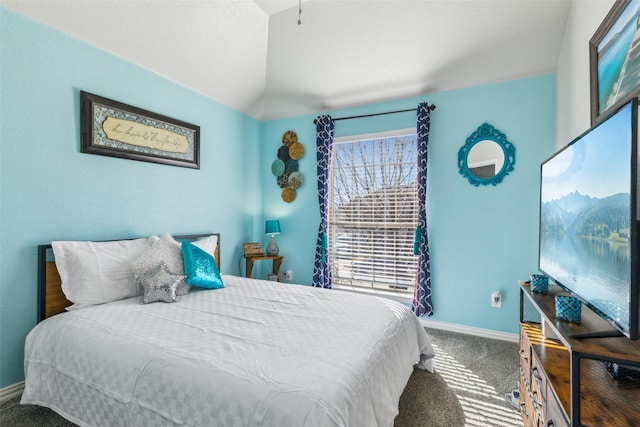 bedroom featuring carpet flooring, baseboards, and lofted ceiling