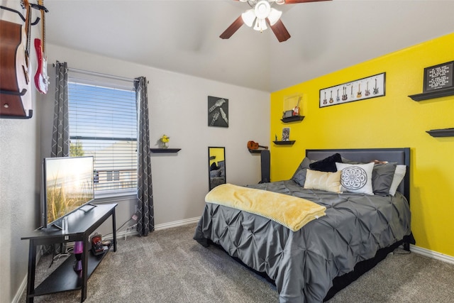 carpeted bedroom with a ceiling fan, lofted ceiling, and baseboards