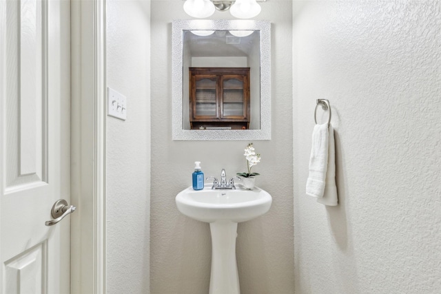 bathroom with a textured wall