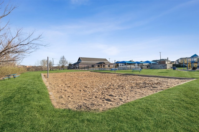 surrounding community featuring a lawn and volleyball court