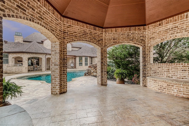 view of patio with a fenced in pool