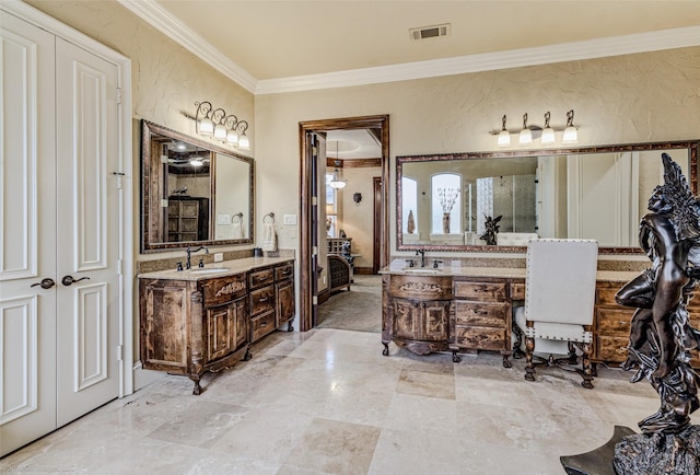 full bath with two vanities, visible vents, and a textured wall