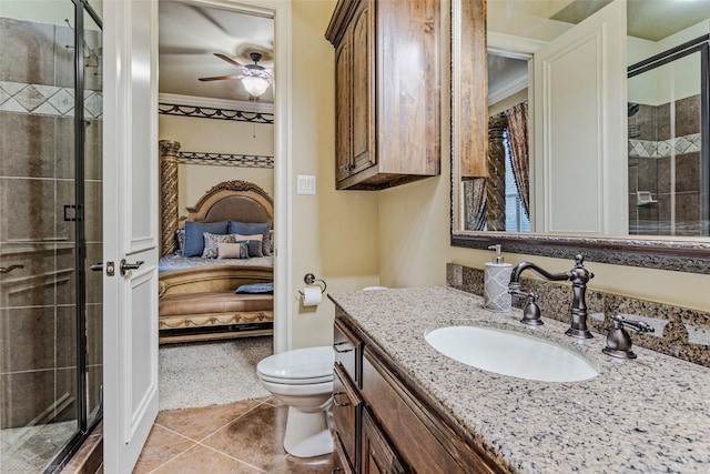 ensuite bathroom featuring toilet, a shower stall, ornamental molding, and ensuite bathroom