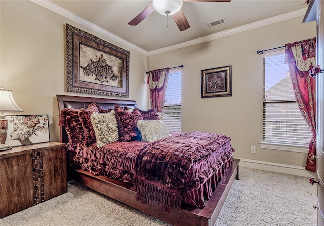 bedroom with ornamental molding, visible vents, carpet flooring, and multiple windows