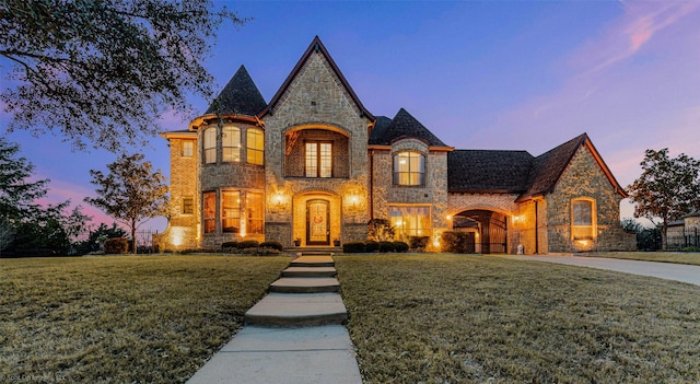 view of front of property with stone siding and a front lawn