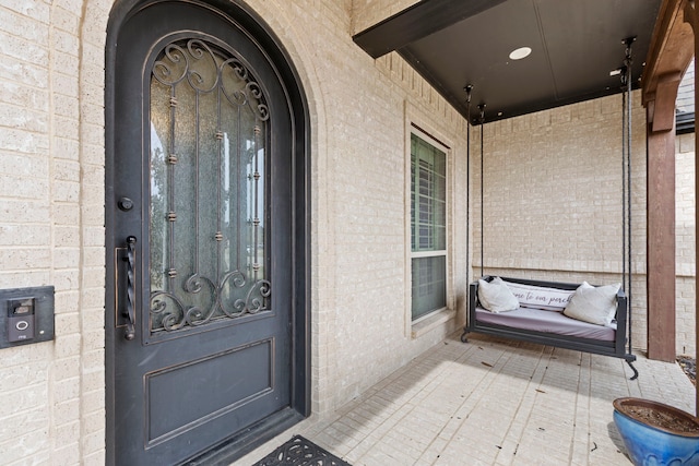 entrance to property with brick siding