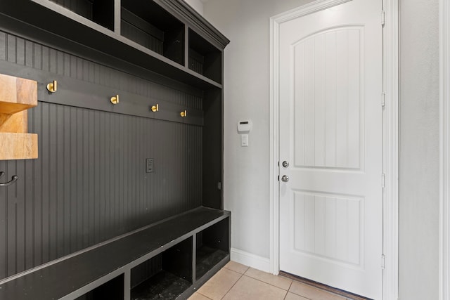 mudroom featuring baseboards and light tile patterned floors