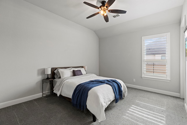 bedroom with lofted ceiling, carpet floors, visible vents, and baseboards