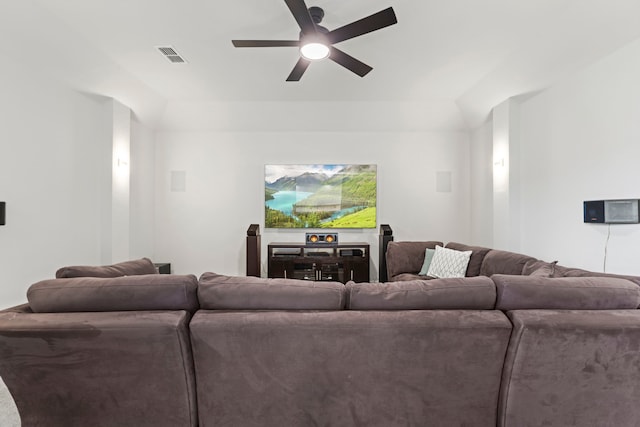 living area with ceiling fan and visible vents