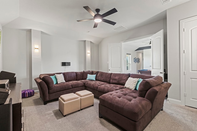 living area with carpet floors, lofted ceiling, visible vents, and a ceiling fan