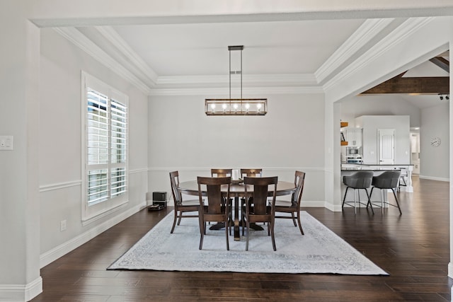 dining room with dark wood-style floors, baseboards, a chandelier, and crown molding