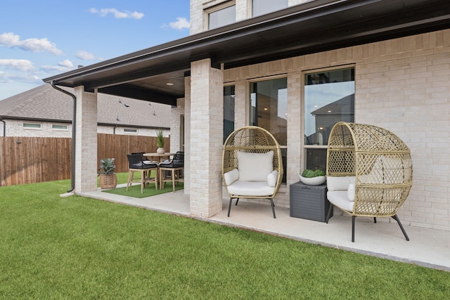 view of patio featuring fence