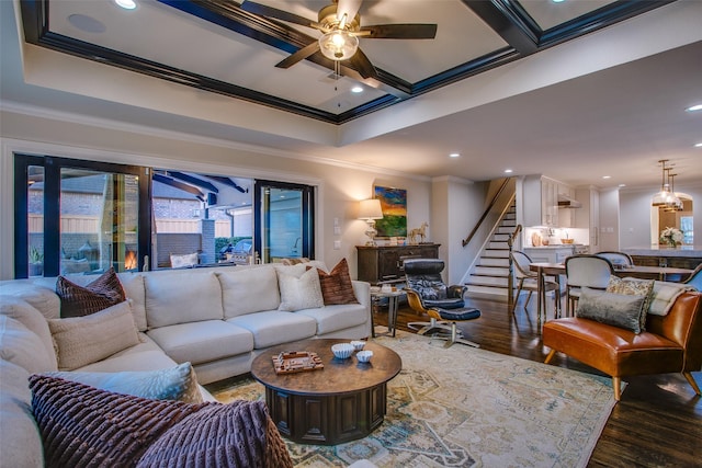 living room featuring a ceiling fan, ornamental molding, wood finished floors, stairs, and recessed lighting