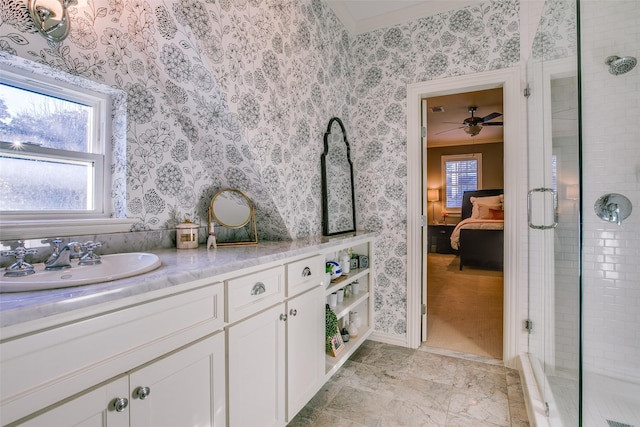 full bath with ensuite bathroom, a stall shower, vanity, and wallpapered walls