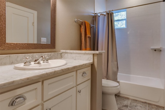 bathroom featuring shower / tub combo, a textured wall, vanity, and toilet