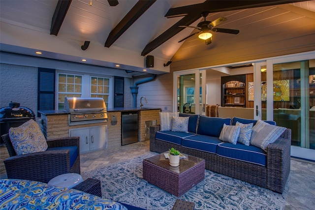 view of patio / terrace with an outdoor kitchen, a ceiling fan, an outdoor hangout area, grilling area, and a sink