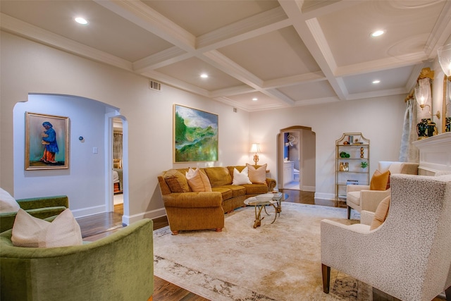 living room with arched walkways, coffered ceiling, beamed ceiling, and wood finished floors