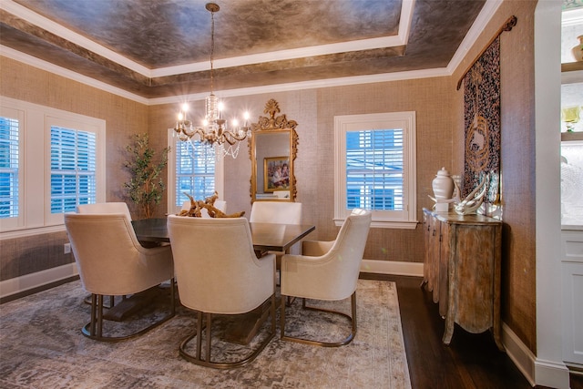 dining area with wallpapered walls, a tray ceiling, dark wood finished floors, and crown molding