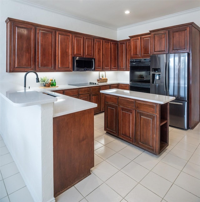 kitchen with crown molding, light countertops, light tile patterned floors, a peninsula, and black appliances