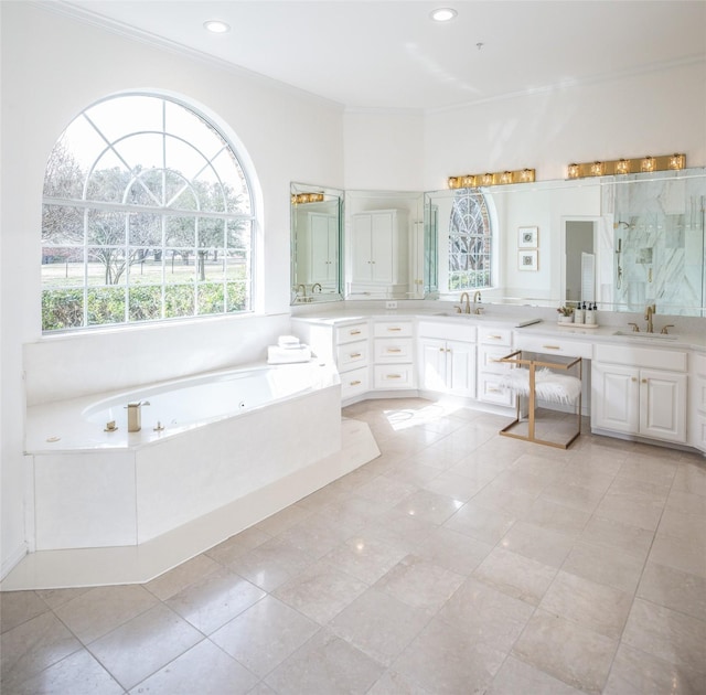 bathroom featuring tile patterned flooring, a garden tub, ornamental molding, vanity, and a shower