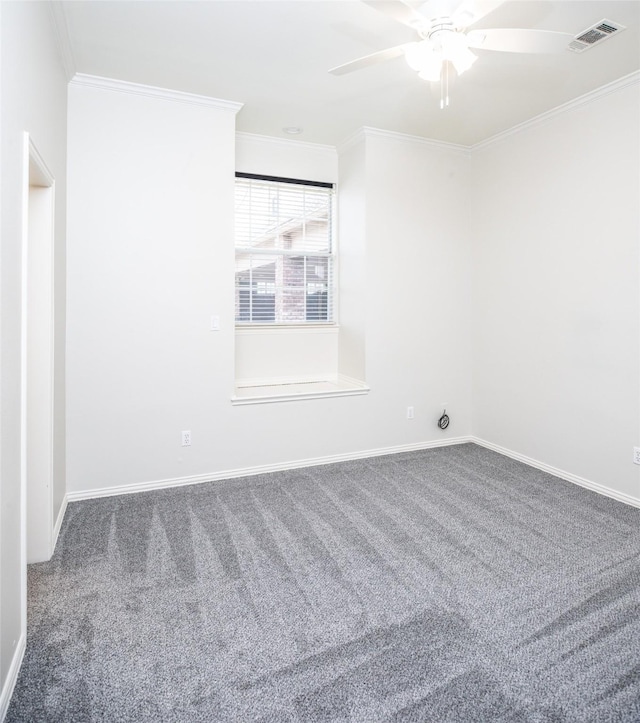 empty room with visible vents, ceiling fan, crown molding, and carpet