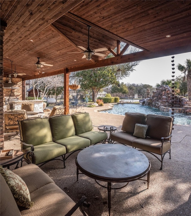 view of patio / terrace with an outdoor pool, ceiling fan, and outdoor lounge area