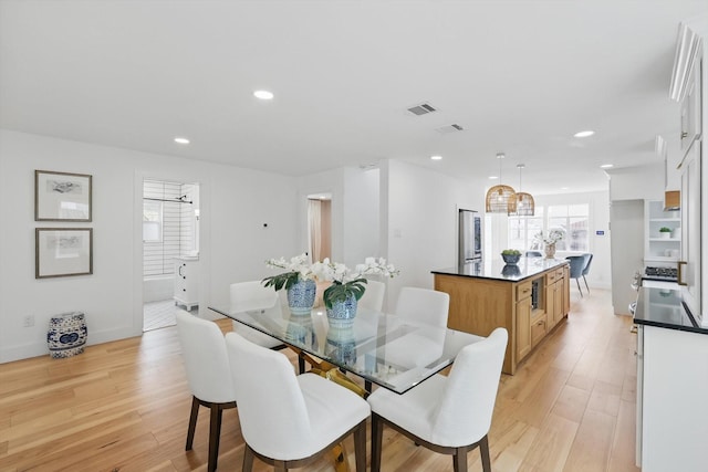 dining space with visible vents, recessed lighting, light wood-type flooring, and baseboards