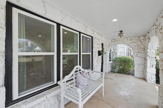 property entrance with stone siding