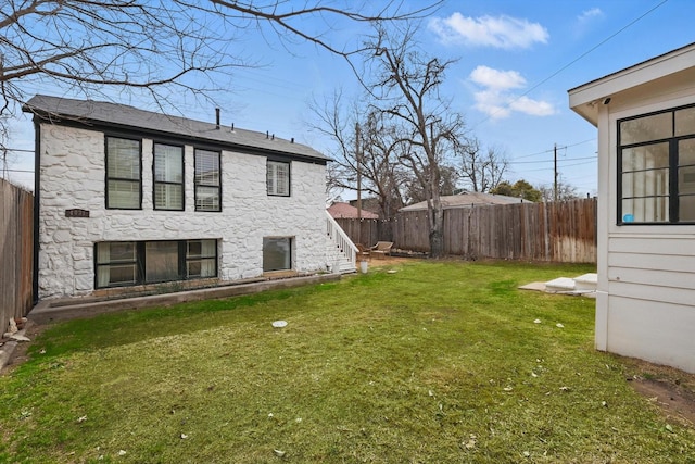 view of yard with a fenced backyard