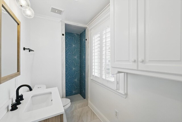 kitchen with visible vents, a sink, stainless steel appliances, light countertops, and white cabinetry