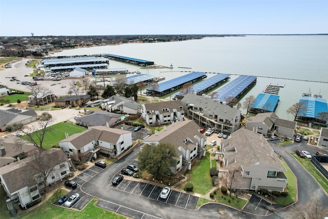 bird's eye view with a residential view and a water view