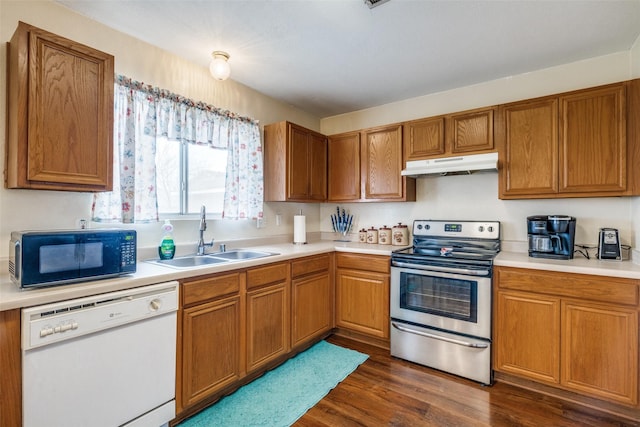 kitchen featuring dishwasher, stainless steel electric stove, light countertops, under cabinet range hood, and a sink