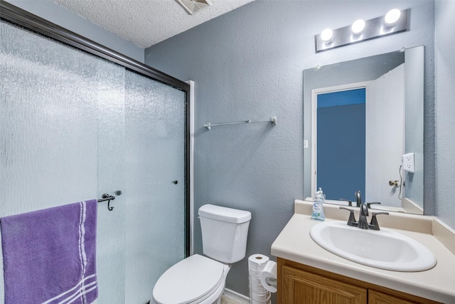 bathroom with a textured wall, toilet, a textured ceiling, vanity, and a shower stall