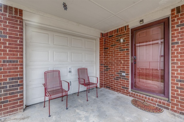 property entrance with brick siding