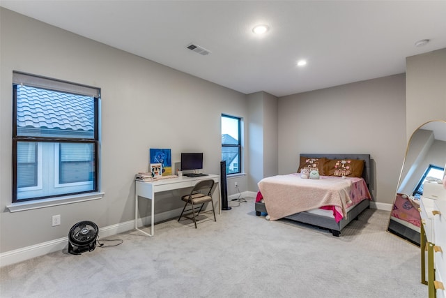 carpeted bedroom featuring arched walkways, visible vents, baseboards, and recessed lighting